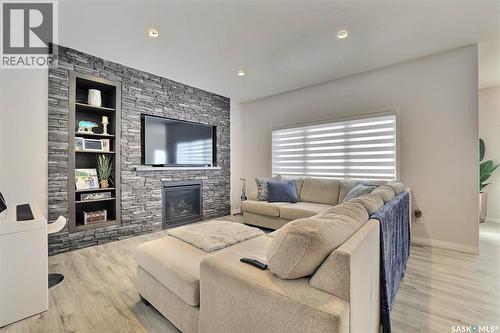 5345 Mckenna Crescent, Regina, SK - Indoor Photo Showing Living Room With Fireplace