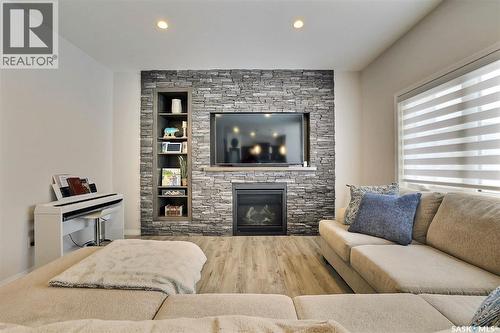 5345 Mckenna Crescent, Regina, SK - Indoor Photo Showing Living Room With Fireplace