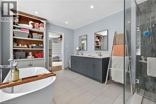 Bathroom with double vanity, a stall shower, a freestanding tub, recessed lighting, and a ceiling fan - 5590 Blind Line, Burlington, ON - Indoor Photo Showing Bathroom
