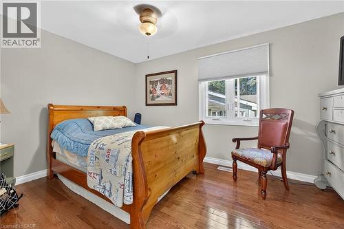Bedroom featuring hardwood / wood-style floors and a ceiling fan - 5590 Blind Line, Burlington, ON - Indoor Photo Showing Bedroom