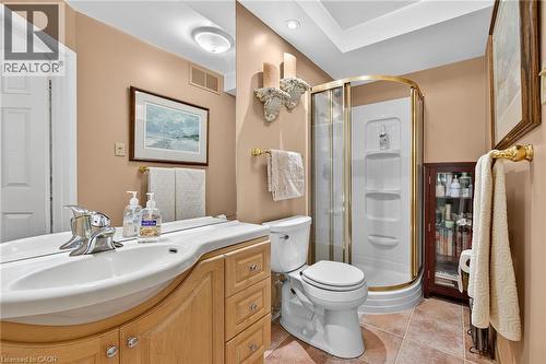 Full bath featuring vanity, a stall shower, and light tile patterned floors - 5590 Blind Line, Burlington, ON - Indoor Photo Showing Bathroom