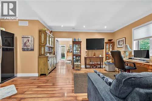 Living area featuring crown molding, an office area, light wood-style floors, and recessed lighting - 5590 Blind Line, Burlington, ON - Indoor