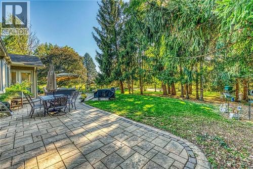 View of patio featuring outdoor dining area - 5590 Blind Line, Burlington, ON - Outdoor