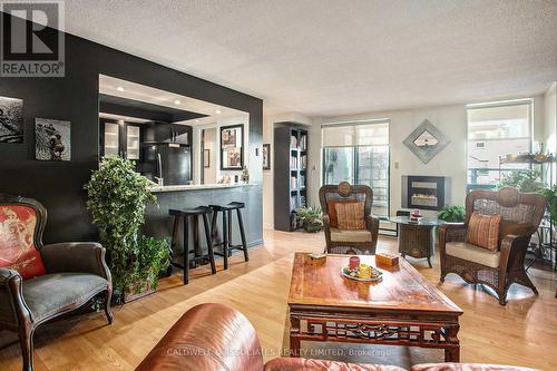 View of Breakfast Bar - 104 - 15 Murray Street, Ottawa, ON - Indoor Photo Showing Living Room With Fireplace