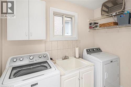 Laundry area with cabinet space - 40 Artistic Boulevard, Hamilton, ON - Indoor Photo Showing Laundry Room