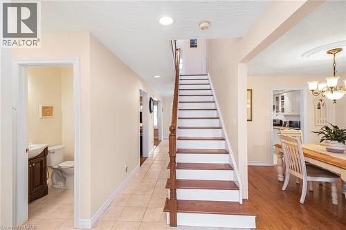 Stairway featuring baseboards and hanging lights - 40 Artistic Boulevard, Hamilton, ON - Indoor