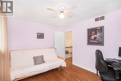 Office area featuring a textured ceiling, wood finished floors, and a ceiling fan - 40 Artistic Boulevard, Hamilton, ON - Indoor Photo Showing Office