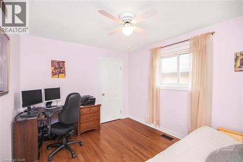 Office space featuring dark wood finished floors, a textured ceiling, and a ceiling fan - 40 Artistic Boulevard, Hamilton, ON - Indoor Photo Showing Other Room