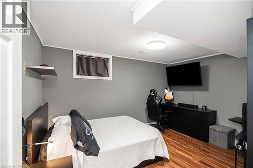 Bedroom with ornamental molding and wood finished floors - 40 Artistic Boulevard, Hamilton, ON - Indoor