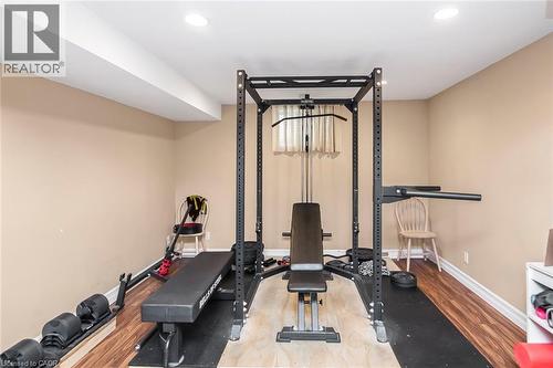 Workout area with light wood-style floors and recessed lighting - 40 Artistic Boulevard, Hamilton, ON - Indoor Photo Showing Gym Room