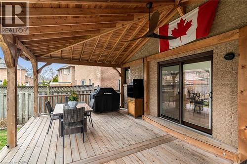 Deck featuring a grill, outdoor dining space, and ceiling fan - 40 Artistic Boulevard, Hamilton, ON - Outdoor With Deck Patio Veranda With Exterior