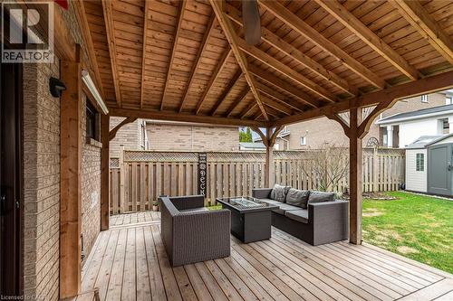 Wooden terrace featuring a fenced backyard, a shed, and an outdoor living space with a fire pit - 40 Artistic Boulevard, Hamilton, ON - Outdoor With Deck Patio Veranda With Exterior
