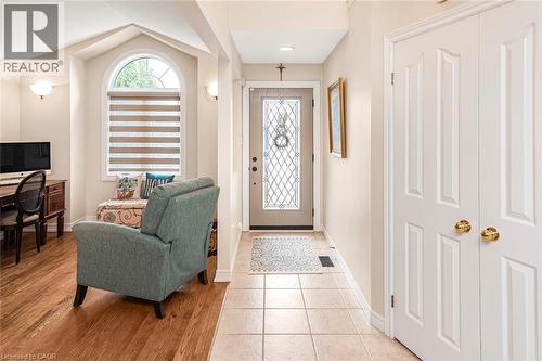 Entryway featuring baseboards and light tile patterned flooring - 40 Artistic Boulevard, Hamilton, ON - Indoor Photo Showing Other Room