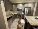 211 115 Willowgrove Crescent, Saskatoon, SK  - Indoor Photo Showing Kitchen With Stainless Steel Kitchen With Double Sink 