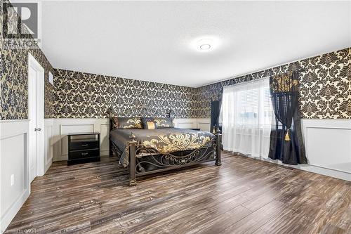 Primary bedroom with double walk in closets and 5 pc ensuite bathroom - 182 Irwin Avenue, Hamilton, ON - Indoor Photo Showing Bedroom