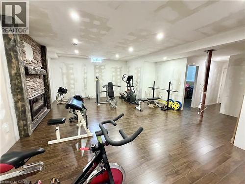 9ft ceilings in basement. Fitness room with stone fireplace - 182 Irwin Avenue, Hamilton, ON - Indoor Photo Showing Gym Room