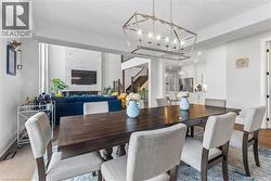 Dining area featuring a chandelier and light wood-style flooring - 