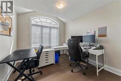 Office space with baseboards and wood finished floors - 
