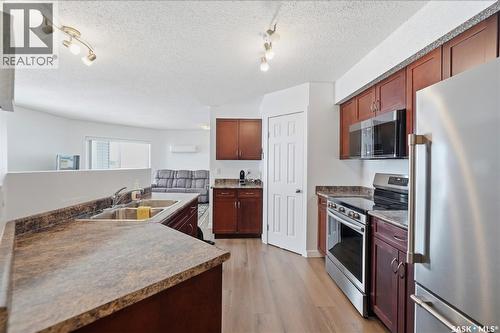401 303 Lowe Road, Saskatoon, SK - Indoor Photo Showing Kitchen With Double Sink