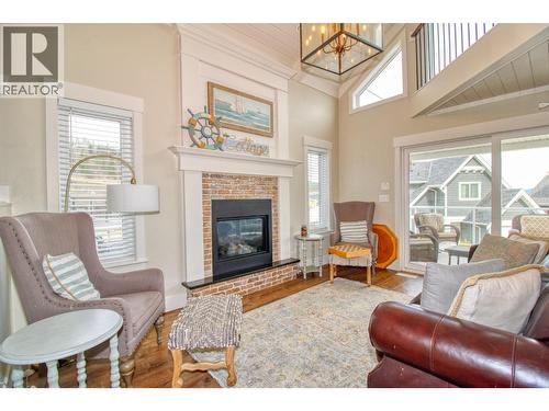 6746 Marbella Loop Unit# 304, Kelowna, BC - Indoor Photo Showing Living Room With Fireplace