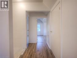 Corridor with wood finished floors and baseboards - 