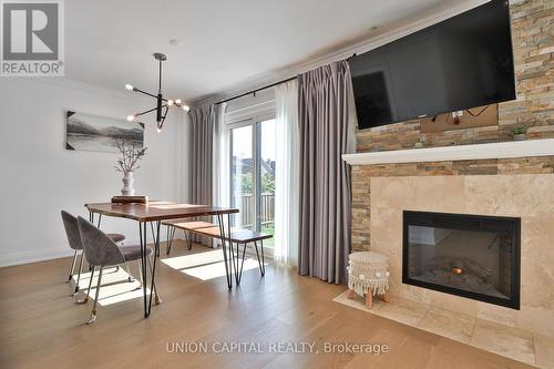 168 Kingsbridge Garden Circle, Mississauga, ON - Indoor With Fireplace