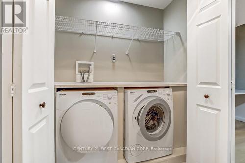 Upper hall laundry with folding table - 2 - 609 Colborne Street, London East (East F), ON - Indoor Photo Showing Laundry Room