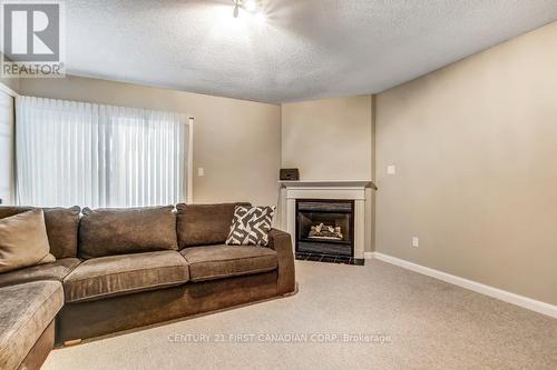 Gas fireplace in walk out family room - 2 - 609 Colborne Street, London East (East F), ON - Indoor Photo Showing Living Room With Fireplace