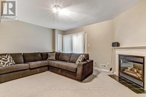Access to patio - 2 - 609 Colborne Street, London East (East F), ON - Indoor Photo Showing Living Room With Fireplace