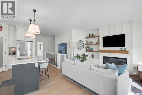9 437 Palmer Crescent, Warman, SK - Indoor With Fireplace