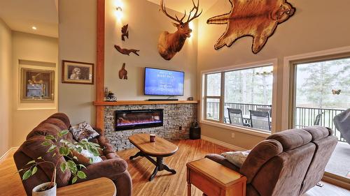 181 The Whins, Cranbrook, BC - Indoor Photo Showing Living Room With Fireplace