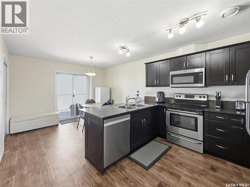 209 3818 Dewdney Avenue E, Regina, SK - Indoor Photo Showing Kitchen With Double Sink