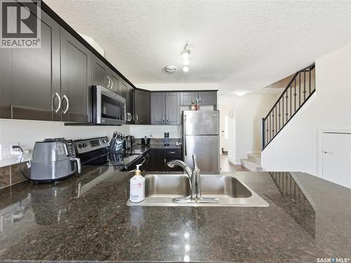 209 3818 Dewdney Avenue E, Regina, SK - Indoor Photo Showing Kitchen With Double Sink