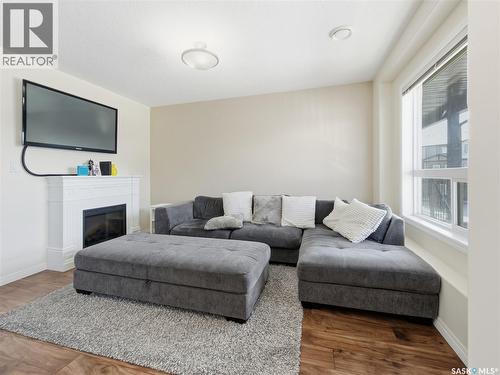 209 3818 Dewdney Avenue E, Regina, SK - Indoor Photo Showing Living Room With Fireplace