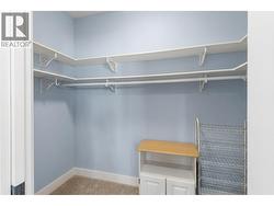 Walk-in closet with access to crawl space - 