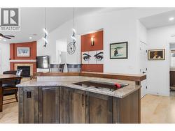 Kitchen island with cooktop - 