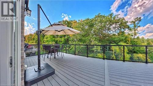Wooden deck with outdoor dining area - 63 Ian Ormston Drive, Kitchener, ON - Outdoor