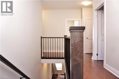 Staircase with wood finished floors and baseboards - 63 Ian Ormston Drive, Kitchener, ON - Indoor Photo Showing Other Room