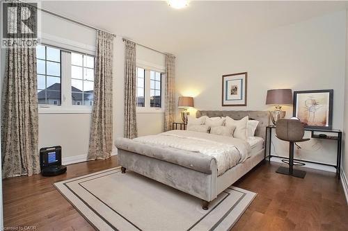 Bedroom featuring dark wood-style flooring - 63 Ian Ormston Drive, Kitchener, ON - Indoor Photo Showing Bedroom