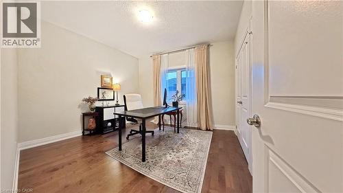 Office area with dark wood-type flooring and a textured ceiling - 63 Ian Ormston Drive, Kitchener, ON - Indoor