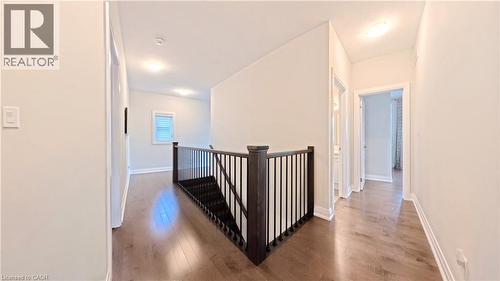 Corridor featuring light wood-type flooring and an upstairs landing - 63 Ian Ormston Drive, Kitchener, ON - Indoor Photo Showing Other Room
