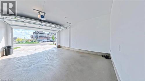 Garage featuring a garage door opener - 63 Ian Ormston Drive, Kitchener, ON - Indoor Photo Showing Garage