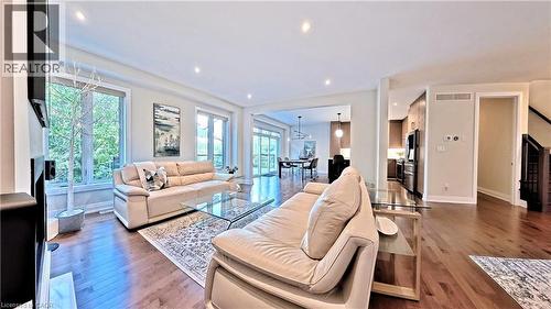 Living room featuring light wood-style flooring and recessed lighting - 63 Ian Ormston Drive, Kitchener, ON - Indoor Photo Showing Living Room