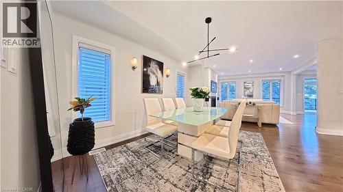 Dining area featuring dark wood-style flooring and recessed lighting - 63 Ian Ormston Drive, Kitchener, ON - Indoor Photo Showing Dining Room