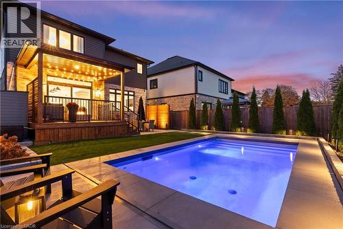 Pool at dusk featuring a patio, a deck, and a fenced backyard - 236 Walker Road, Pelham, ON - Outdoor With In Ground Pool With Deck Patio Veranda