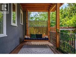 Gorgeous covered porch with swing - 