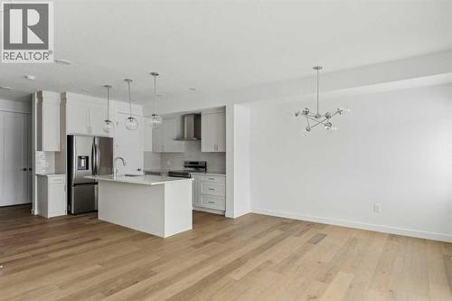 25 Linden Place, Rural Red Deer County, AB - Indoor Photo Showing Kitchen With Upgraded Kitchen