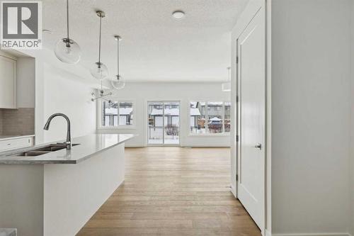 25 Linden Place, Rural Red Deer County, AB - Indoor Photo Showing Kitchen With Double Sink