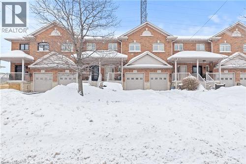 Traditional-style house with covered porch and brick siding - 1069 Beach Boulevard, Hamilton, ON - Outdoor With Facade