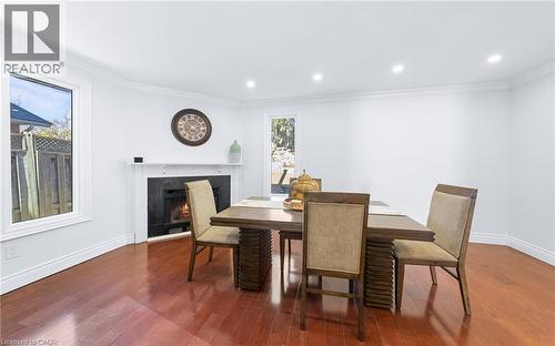 spacious dining area with potlights and windows - 46 Novoco Drive, Hamilton, ON - Indoor Photo Showing Dining Room With Fireplace